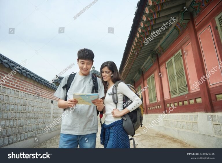 etudiant avec valise devant carte coree